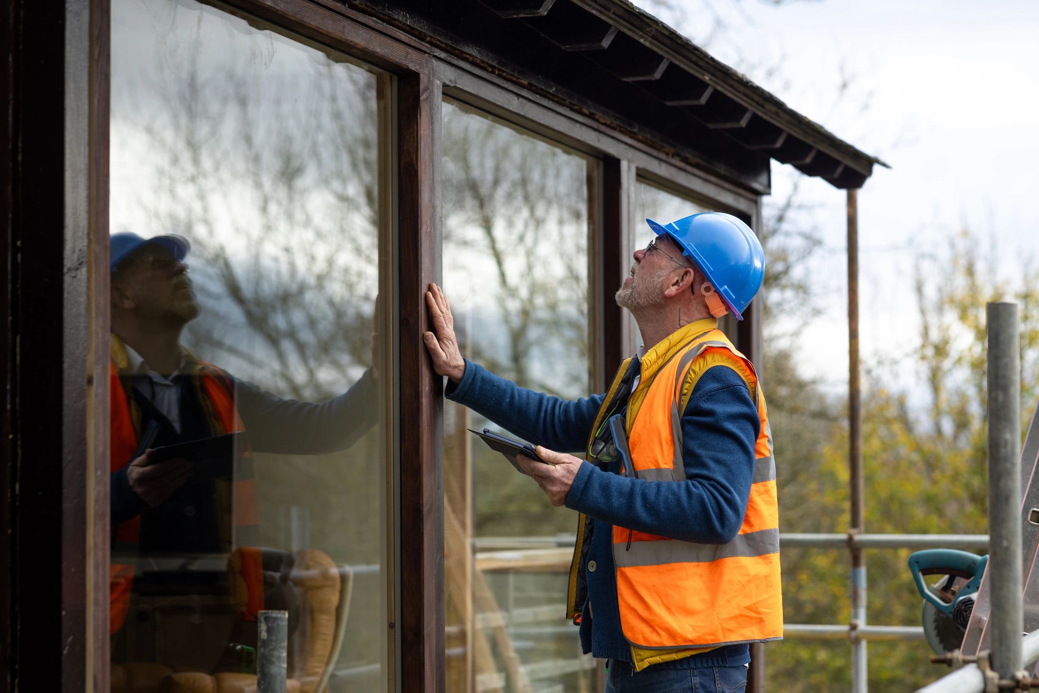 Technician inspecting completed home repair work
